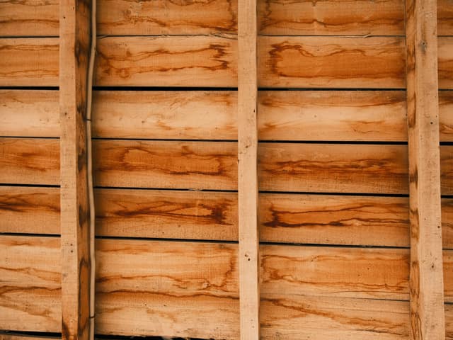 Horizontal cedar boards fixed to vertical rails, showing the grain.